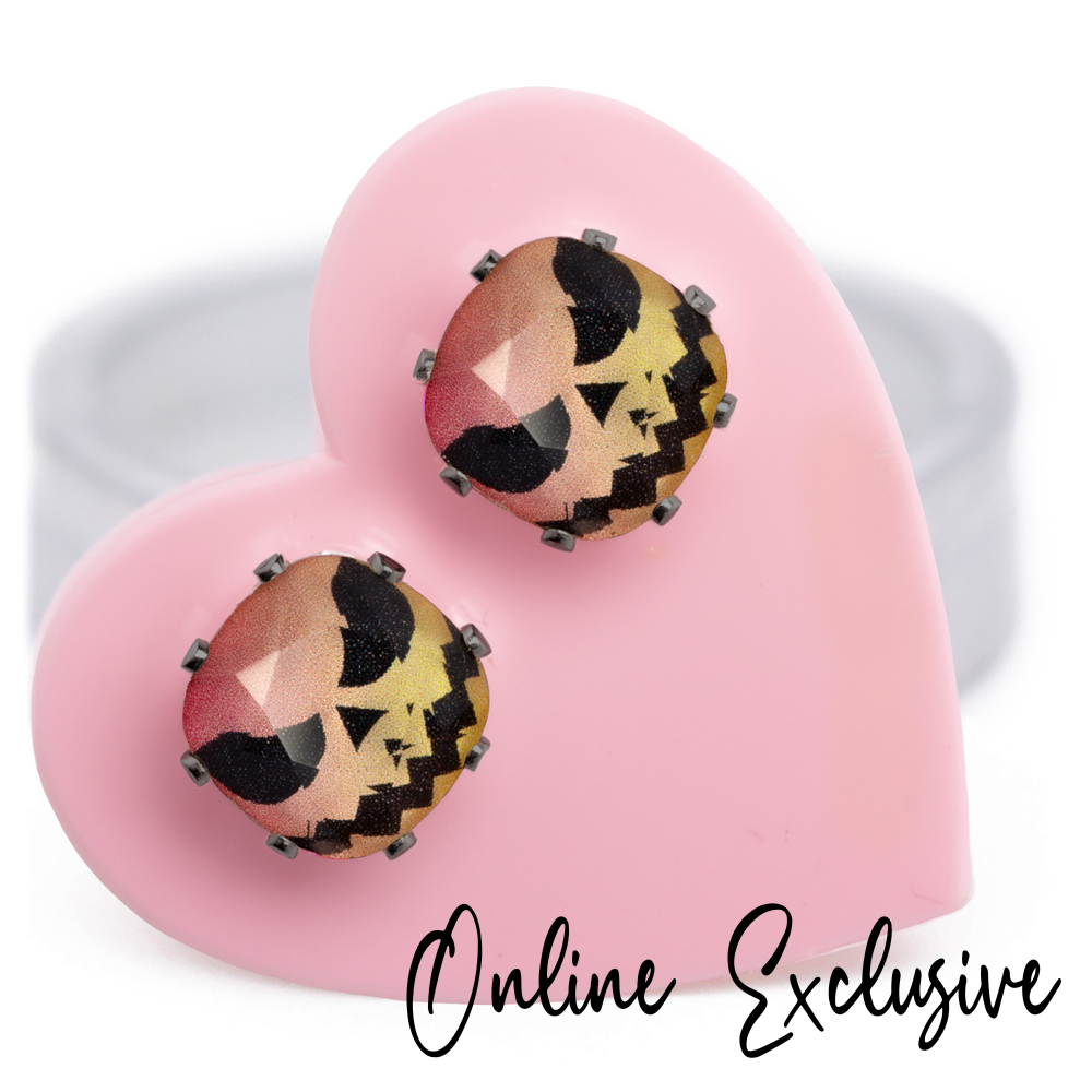 Hi Jack! Cushion stud earrings in playful pink and orange crystals, set in hematite, carded on a pink heart.