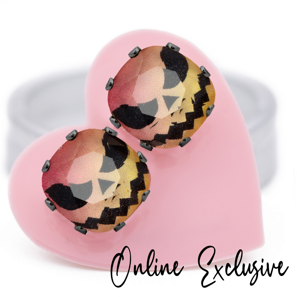 Hi Jack! Cushion stud earrings in playful pink and orange crystals, set in hematite, carded on a pink heart.