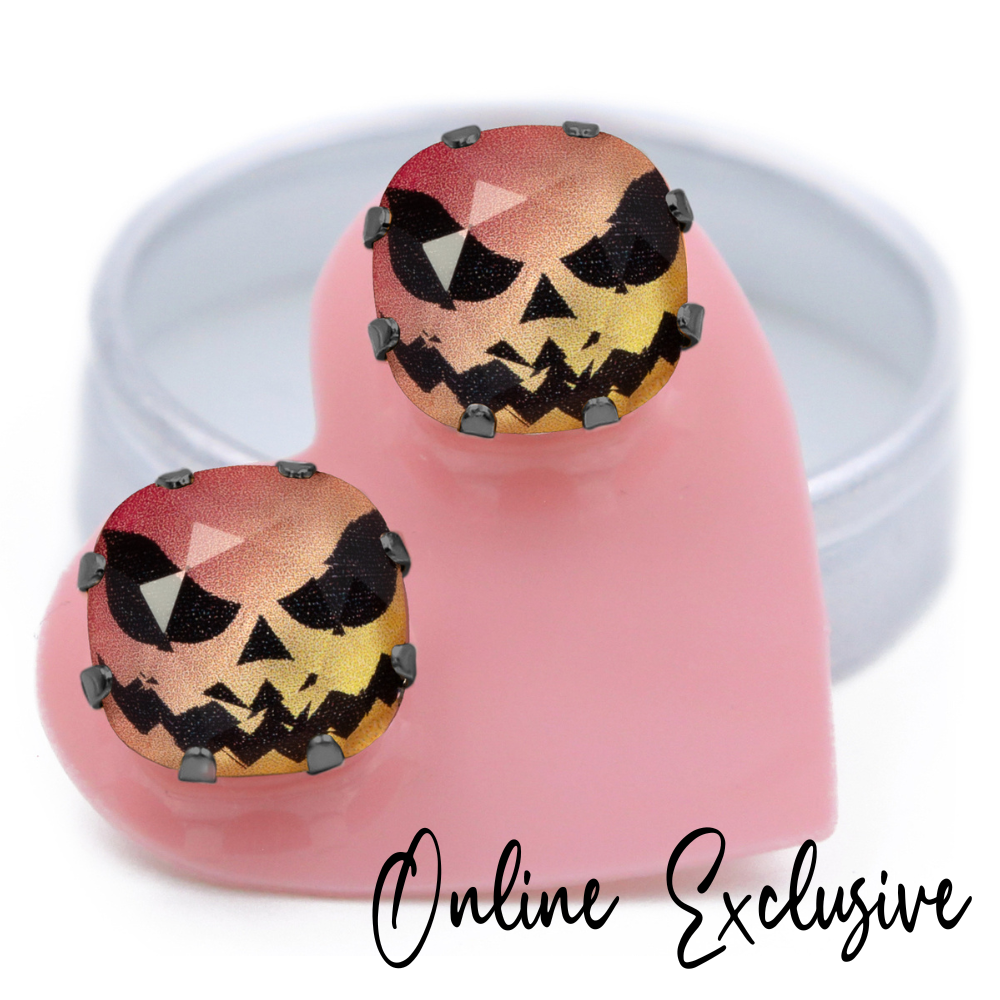 Hi Jack! Mega Cushion stud earrings in playful pink and orange crystals, exclusively set in hematite, carded on a pink heart.