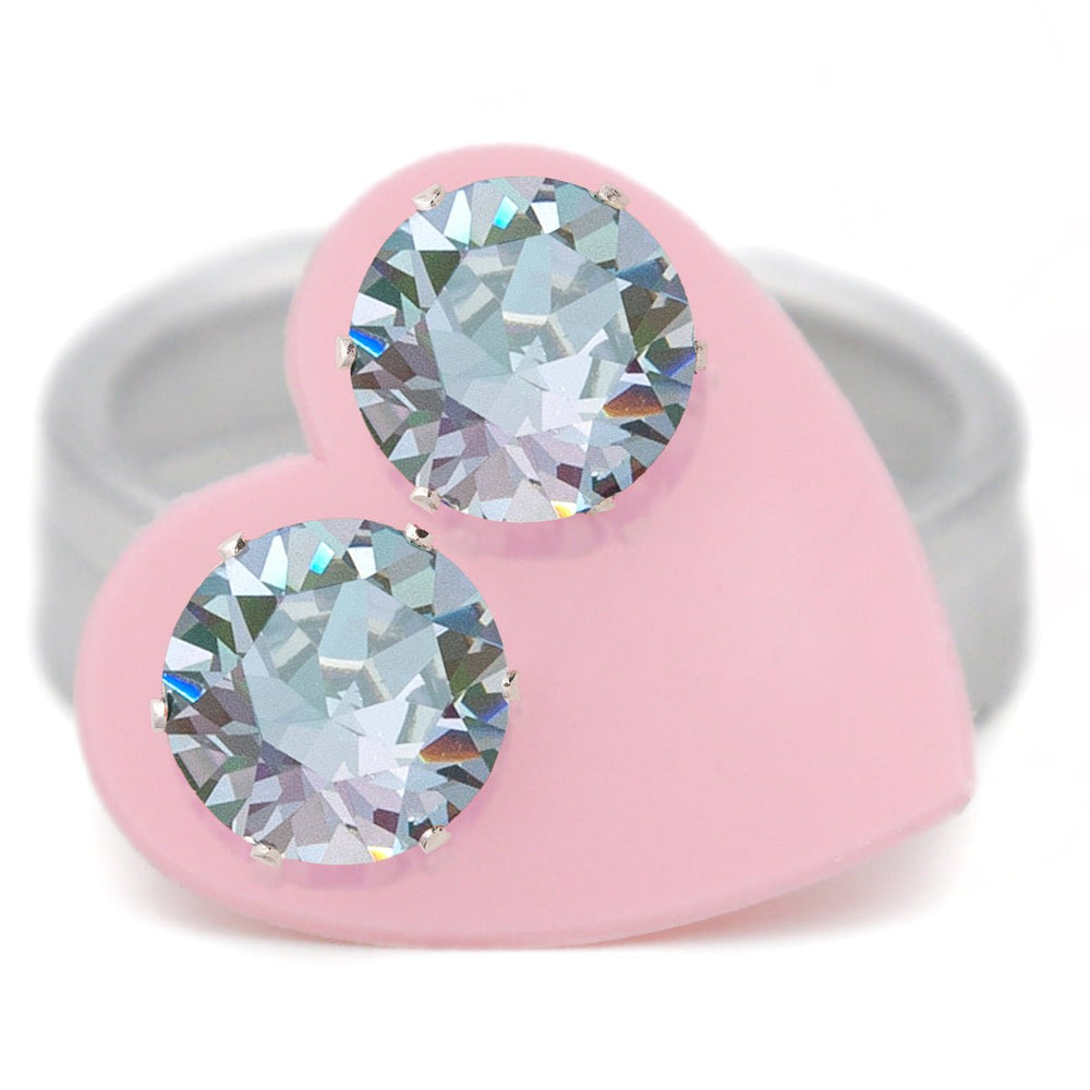 A pair of original round grey-blue-purple Austrian crystal stud earrings in .925 sterling silver, 10–11.25mm, carded on a pink heart