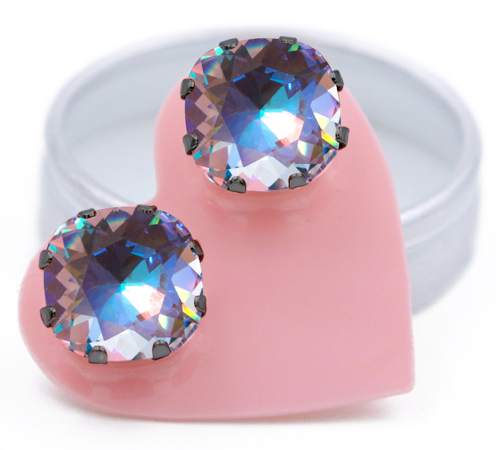 Dark Angel Mega Cushion stud earrings with clear crystals flashing purple, aqua, pink, green, yellow, and orange in Hematite