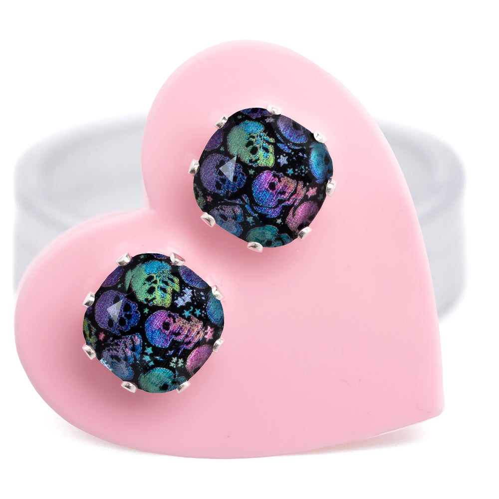 Deadly Disco Mini Cushion stud earrings with petite crystals with bright skulls, set in .925 Sterling Silver, on a pink heart