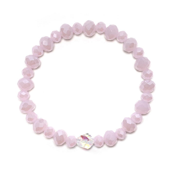 The most Glam way to stack your wrists in sparkle. Our Pink Opal Stacker features baby doll pink beads with an opalescent sparkle and our signature Crystal AB helix bead, front and center.
